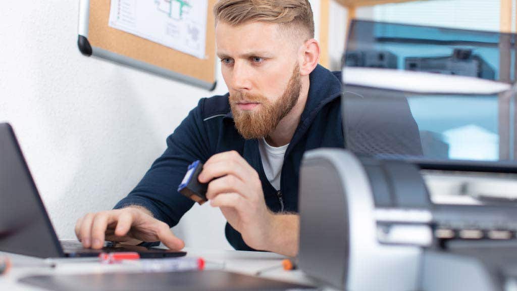 Man printing a document inside an office