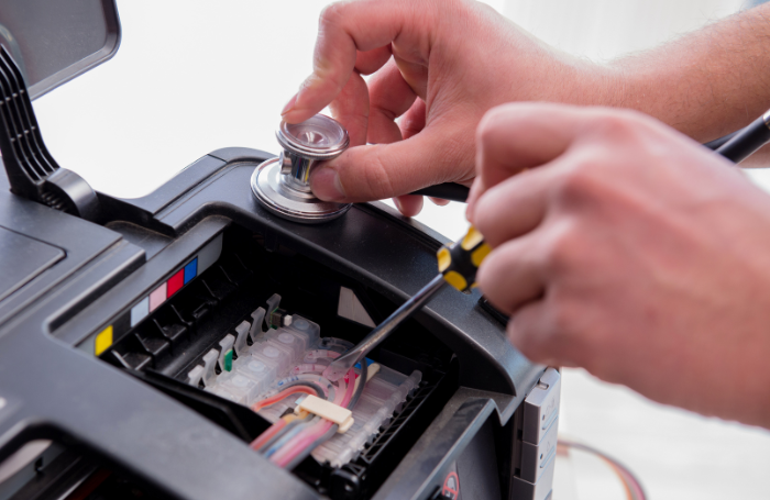 person ixing printer ink cartridges