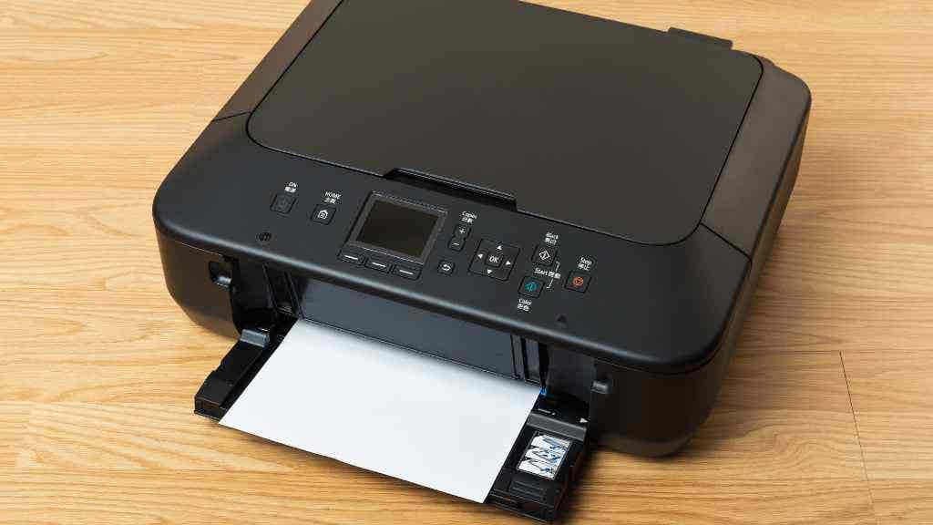 Photo of a black photo printer on a desk