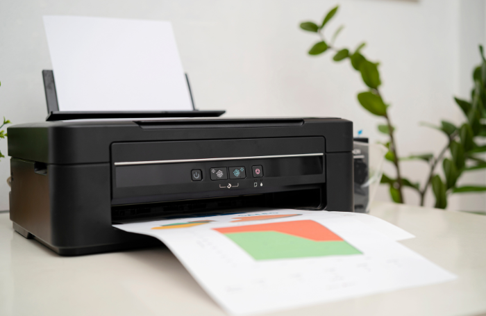 Black Canon printer with colored printout