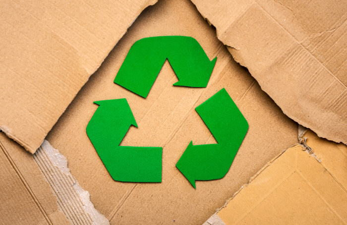 recycle logo on top of cardboard boxes