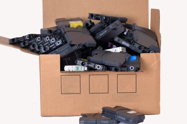 empty ink cartridges in a recycling box