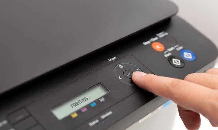 Pushing printer power button