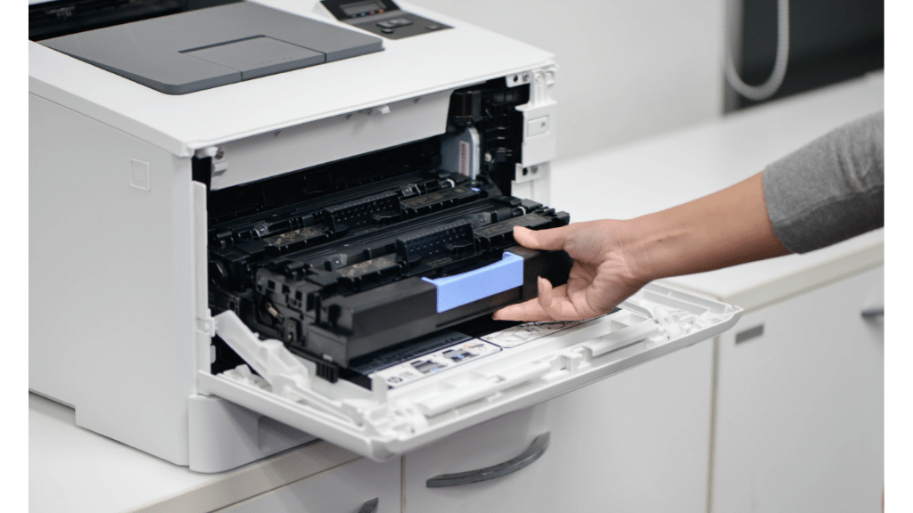 person holding a toner cartridge