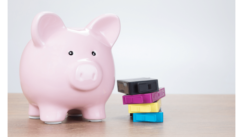 piggy bank beside printer cartridges