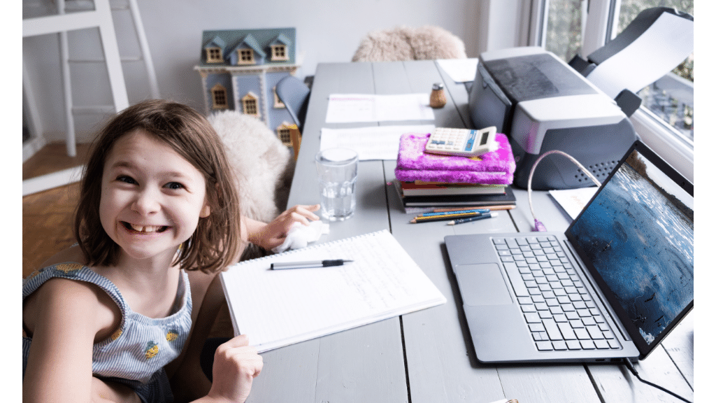 Photo of little girl doing homework