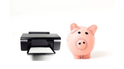 black printer beside a piggybank