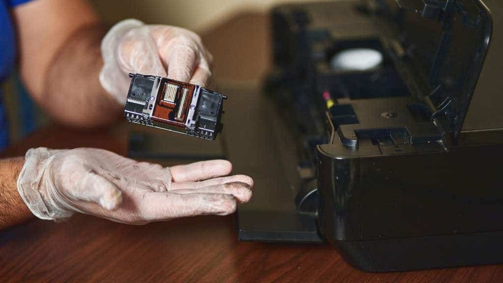 Person cleaning printhead