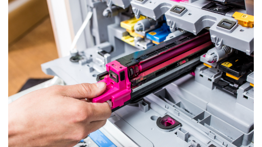 InkJets BLOG - Image of person replacing a toner cartridge Person replacing a toner cartrdrige from a printer